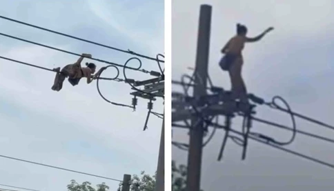Người phụ nữ có biểu hiện bất thường 'diễn xiếc' trên dây điện