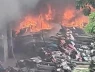 Hiện trường tan hoang vụ cháy bãi xe khiến hàng trăm phương tiện trơ khung ở gần cầu Vĩnh Tuy, Hà Nội