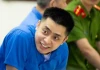 Nụ cười lạnh người của Bùi Đình Khánh trong phiên xét xử ngày 13/5...