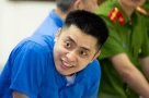Nụ cười lạnh người của Bùi Đình Khánh trong phiên xét xử ngày 13/5...