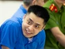 Nụ cười lạnh người của Bùi Đình Khánh trong phiên xét xử ngày 13/5...