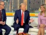 Tại sao có tấm vải sẫm màu lót dưới chỗ ông Trump ngồi?